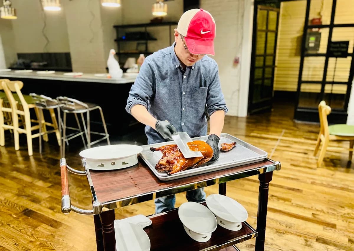 Chef Tian slicing Beijing duck